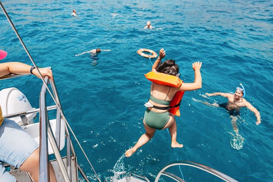 Costa Adeje: Whale Watching Catamaran Tour with Drinks - Dolphins near fish farms, plus the squid trivia you’ll actually remember