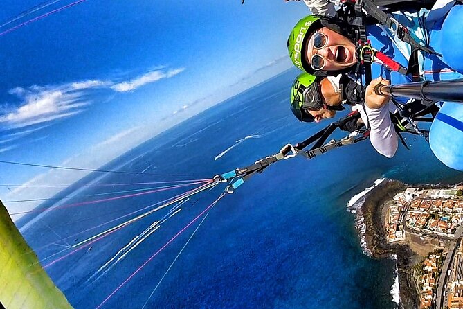 GOLD paragliding flight including videos/photos, t-shirt and a bottle of Cava - Landing at La Caleta Beach, and What If Conditions Change
