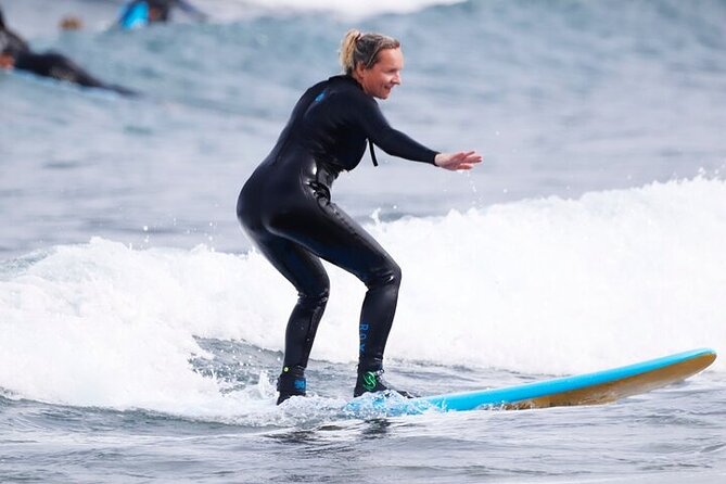 Group Surf Class in Playa de Las Américas with Photographs - Coaching in the water: how you progress from paddling to your first ride