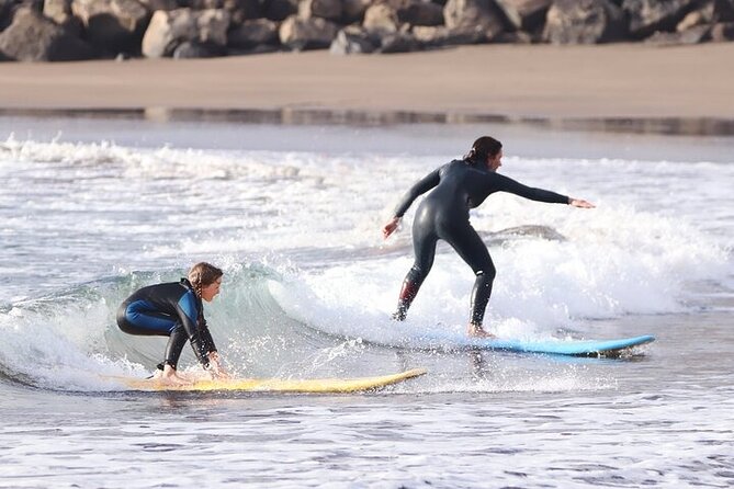 Group Surf Class in Playa de Las Américas with Photographs - Photos and souvenirs: why the t-shirt detail matters