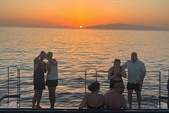 Tenerife Sunset Catamaran tour with transfer - Food and Drinks included. - The swim stop: 20 minutes to cool off, and you need the gear